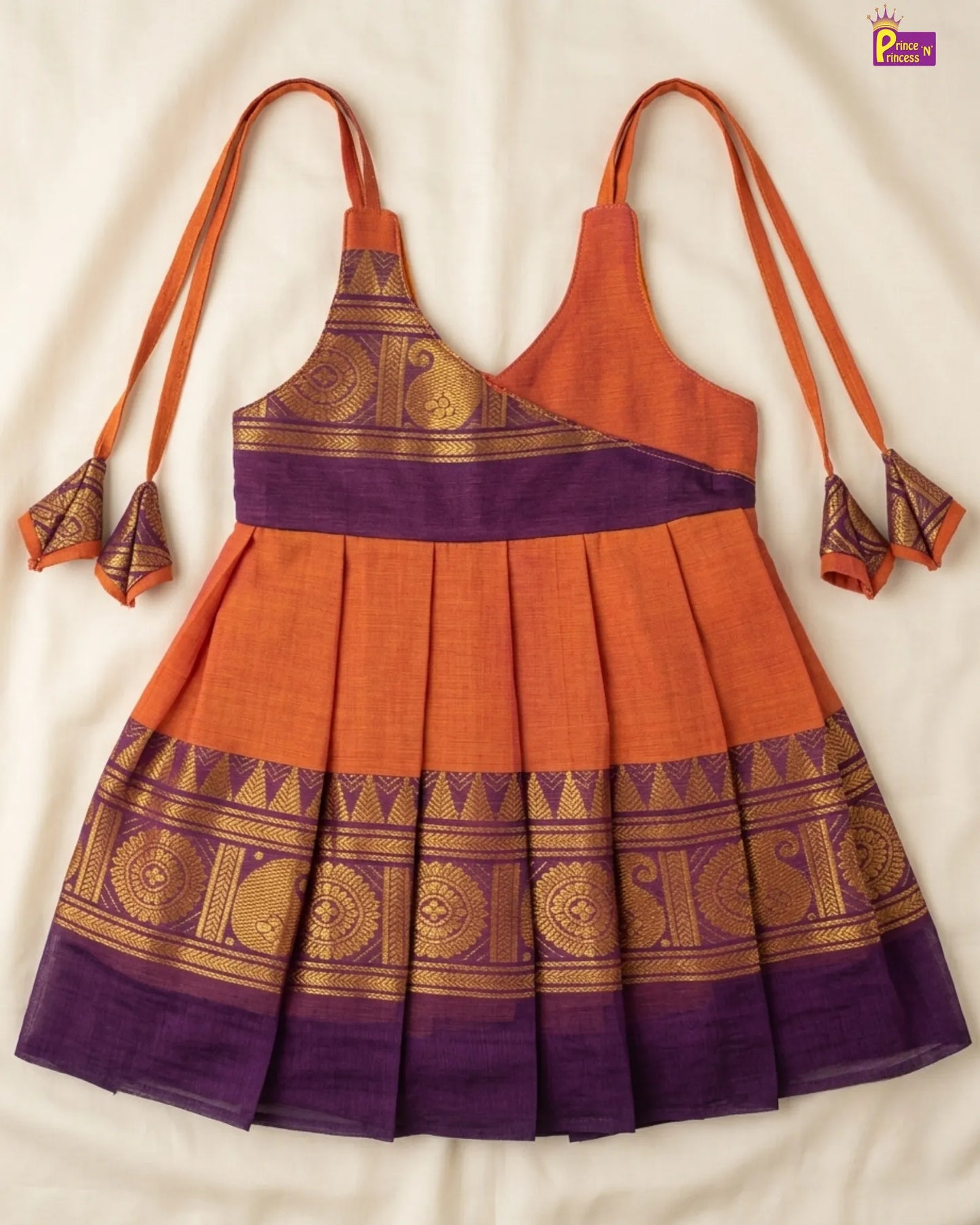 Orange and purple traditional dress with gold patterns on a white background