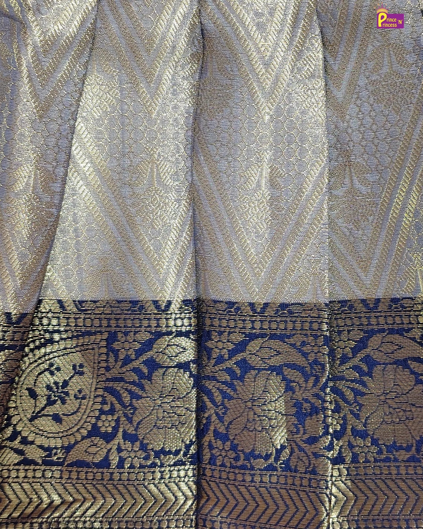 Patterned fabric with geometric and floral designs in blue and gold.
