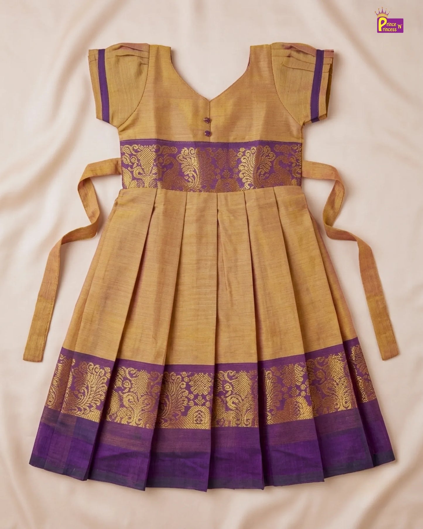 Traditional yellow and purple dress with intricate patterns on a beige background