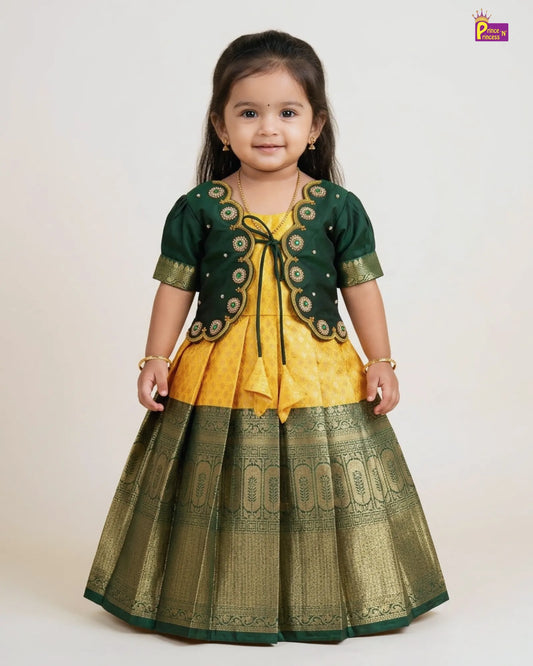 Young girl wearing a green and yellow traditional outfit on a white background