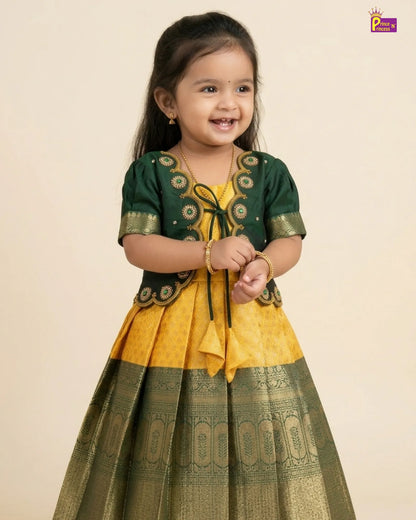 Young girl wearing a green and yellow traditional outfit on a beige background