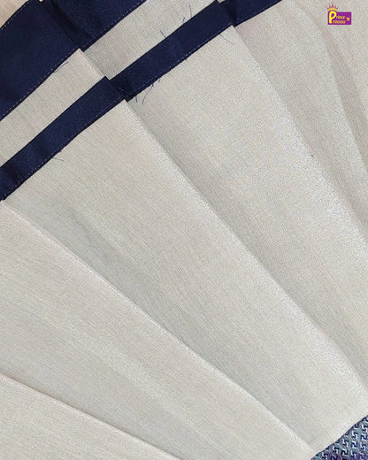 Close-up of a white fabric with a blue border