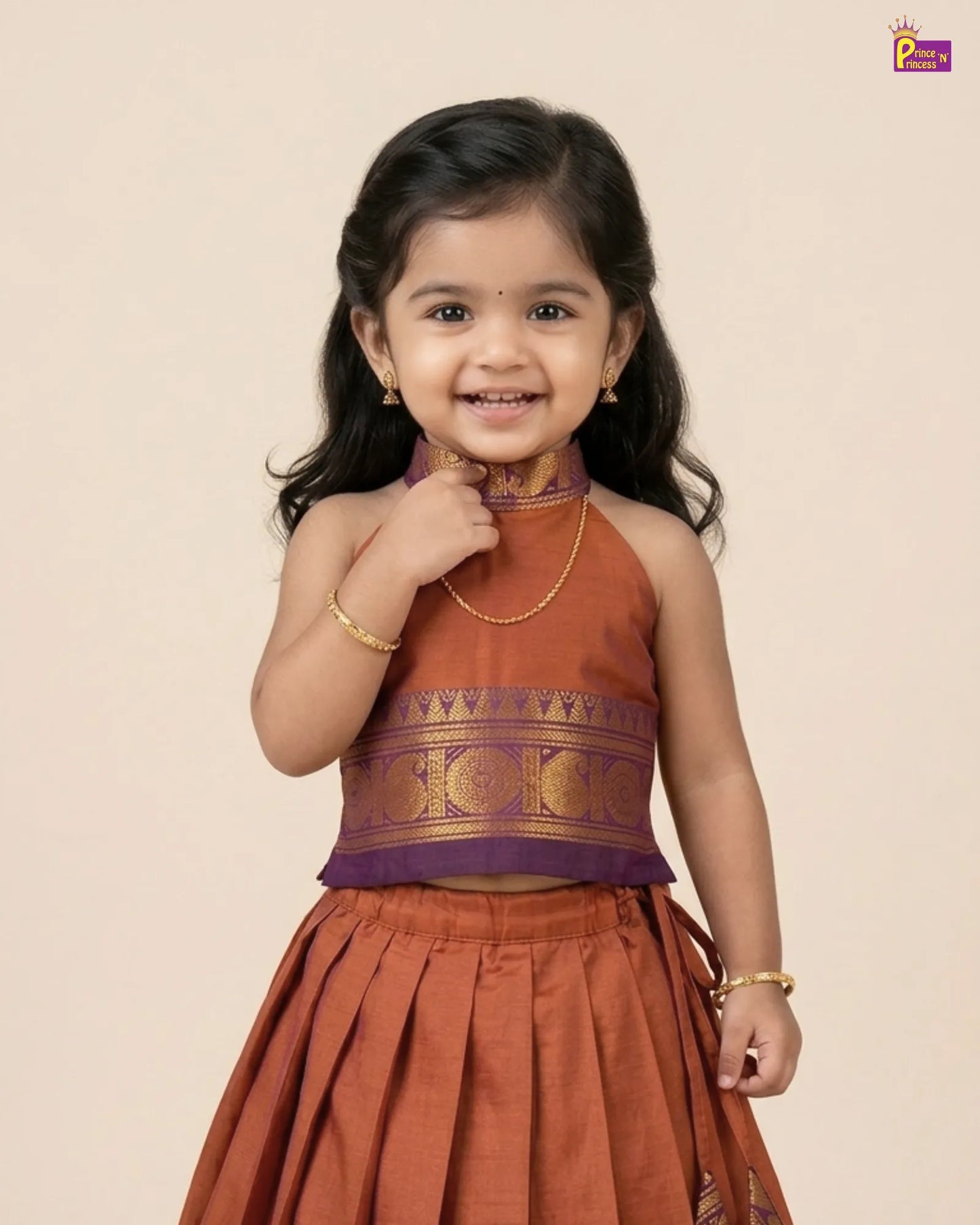 Young girl wearing a traditional outfit with a beige background