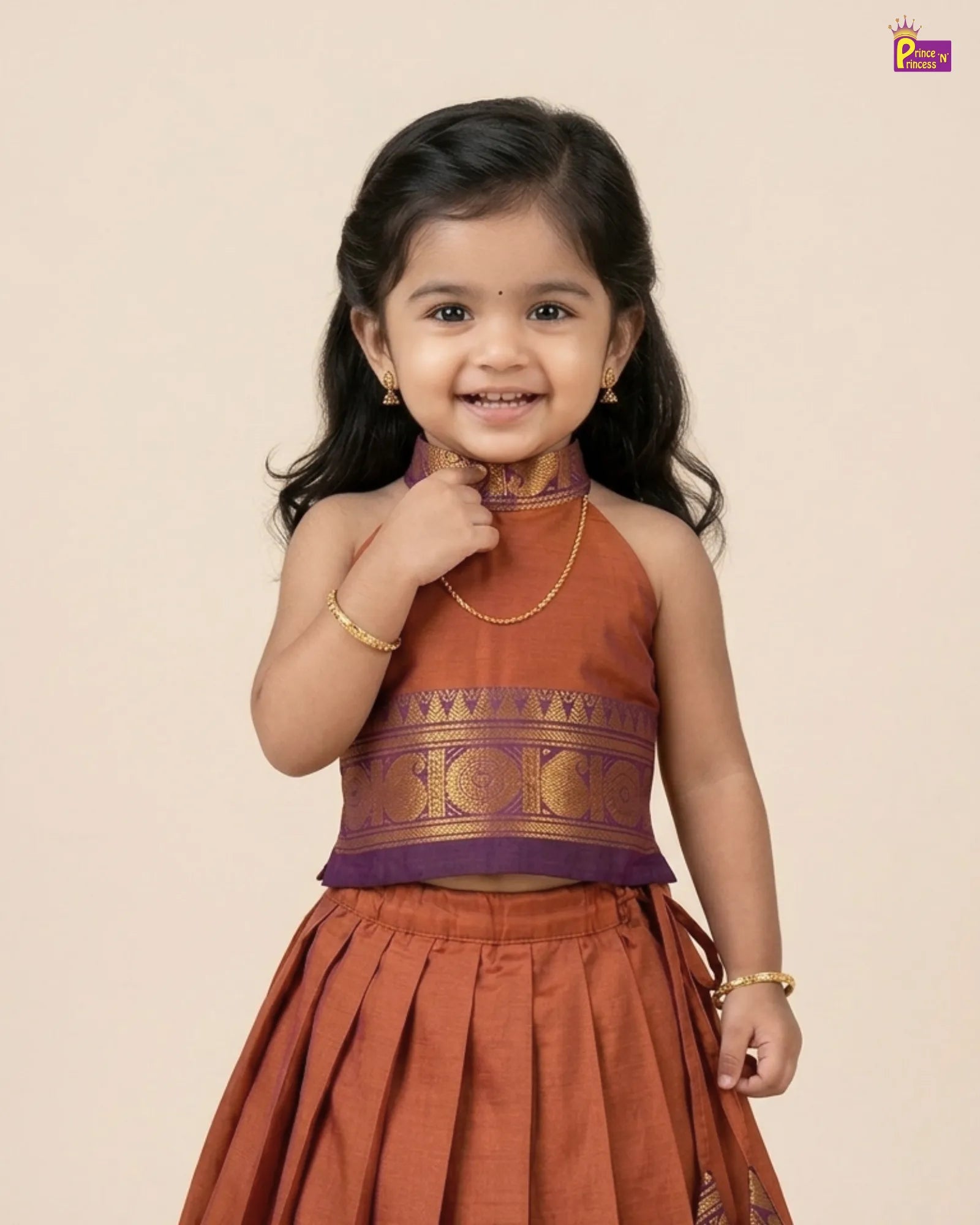 Young girl wearing a traditional outfit with a beige background