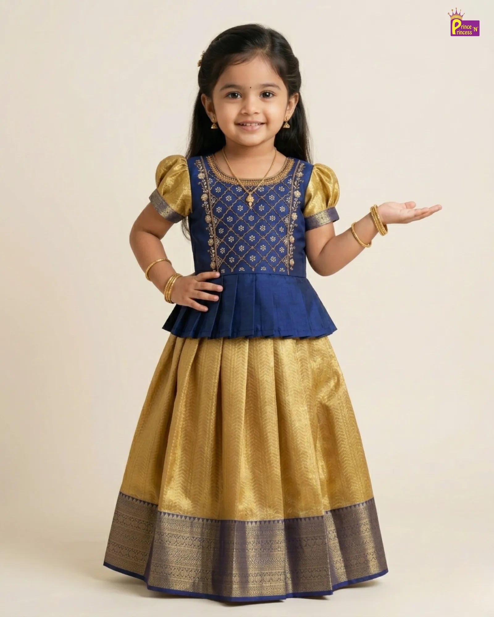 Young girl wearing a blue and gold traditional outfit on a beige background