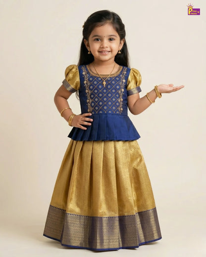 Young girl wearing a blue and gold traditional outfit on a beige background