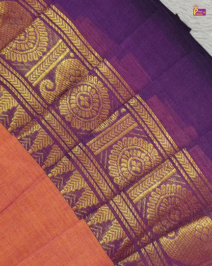 Close-up of a purple fabric with gold intricate patterns