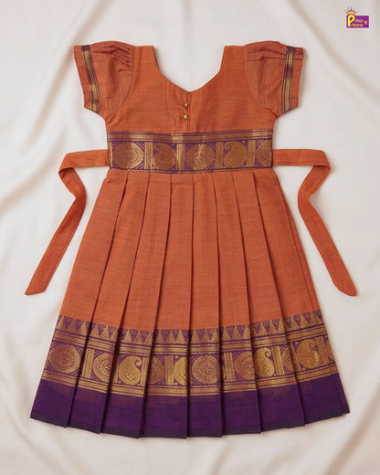 Orange and purple traditional dress with decorative patterns on a white background