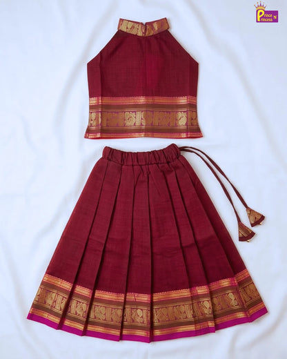 Maroon traditional outfit with gold patterns on a white background