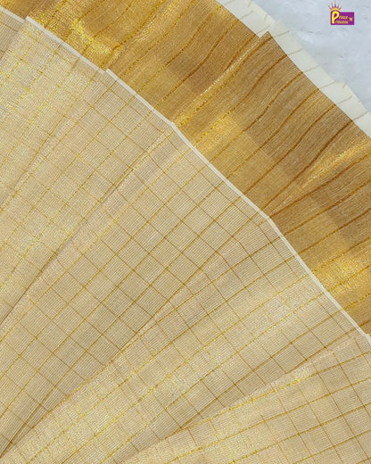 Close-up of beige fabric with gold embroidery on a white background