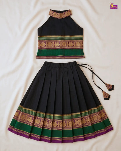 Traditional outfit with a black top and pleated skirt on a white background