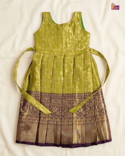 Green and brown dress with a belt on a white background