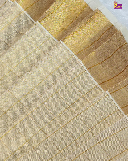 Close-up of a fabric with gold and beige patterns