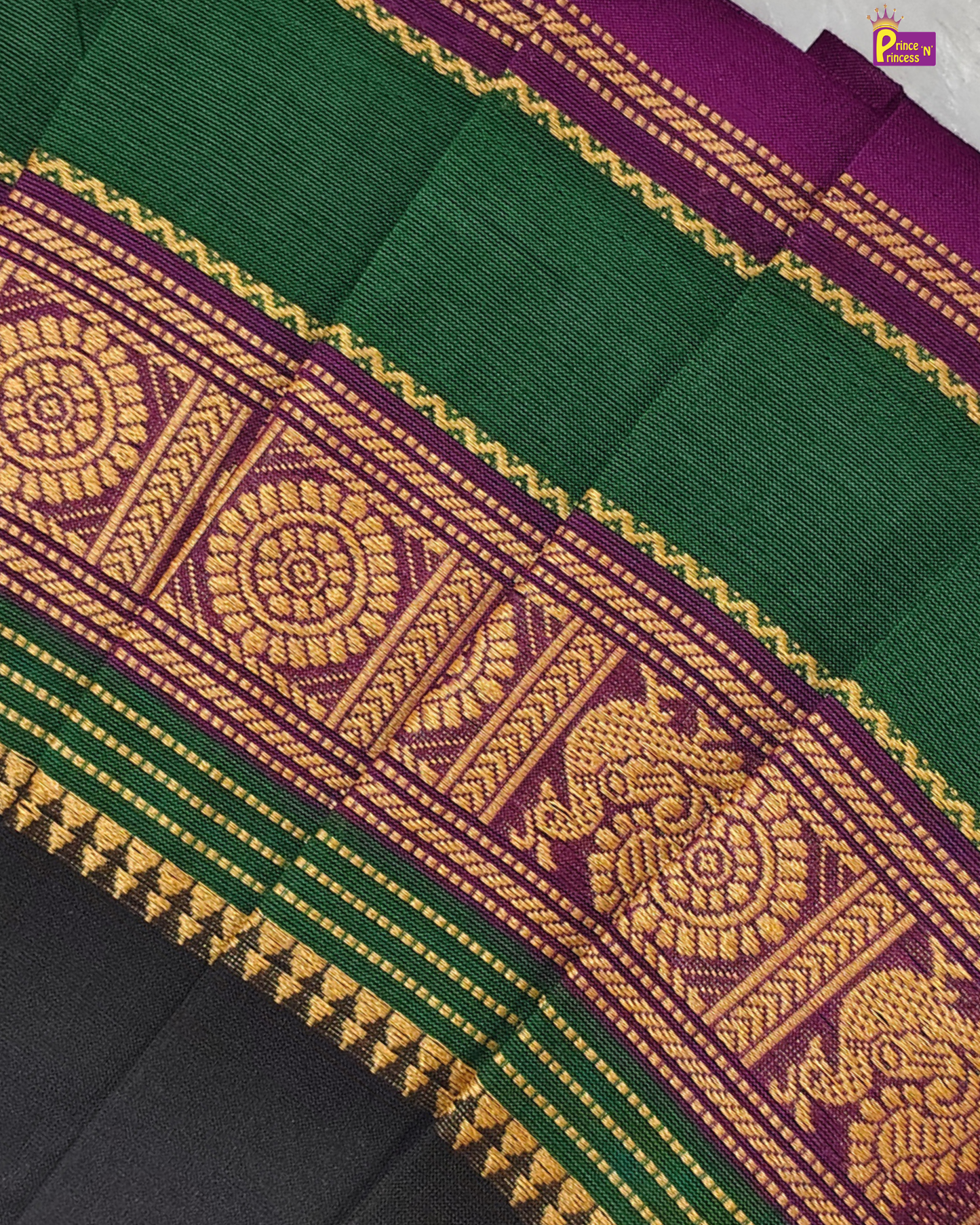 Green and purple fabric with intricate gold patterns