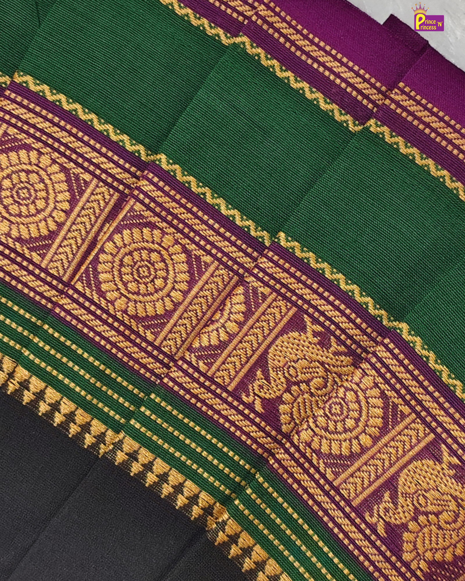 Green and purple fabric with intricate gold patterns