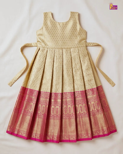 Beige and red patterned dress with tied sleeves on a light background