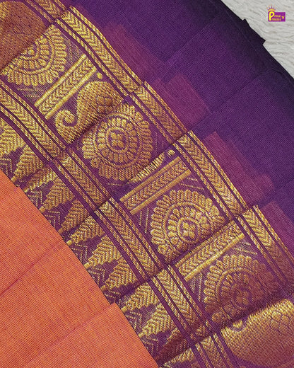 Close-up of a purple fabric with gold intricate patterns