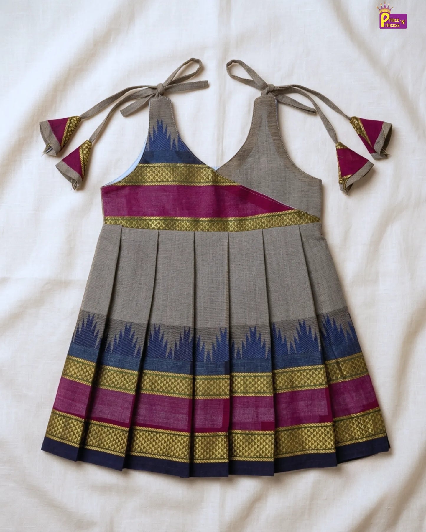 Traditional dress with colorful patterns on a white background