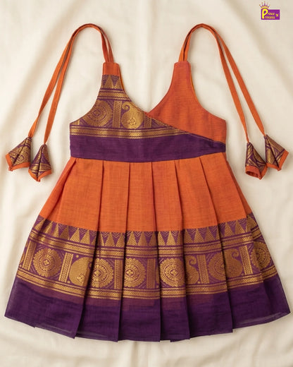 Orange and purple traditional dress with gold patterns on a white background