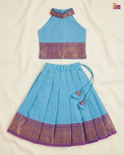 Blue traditional outfit with purple accents on a beige background