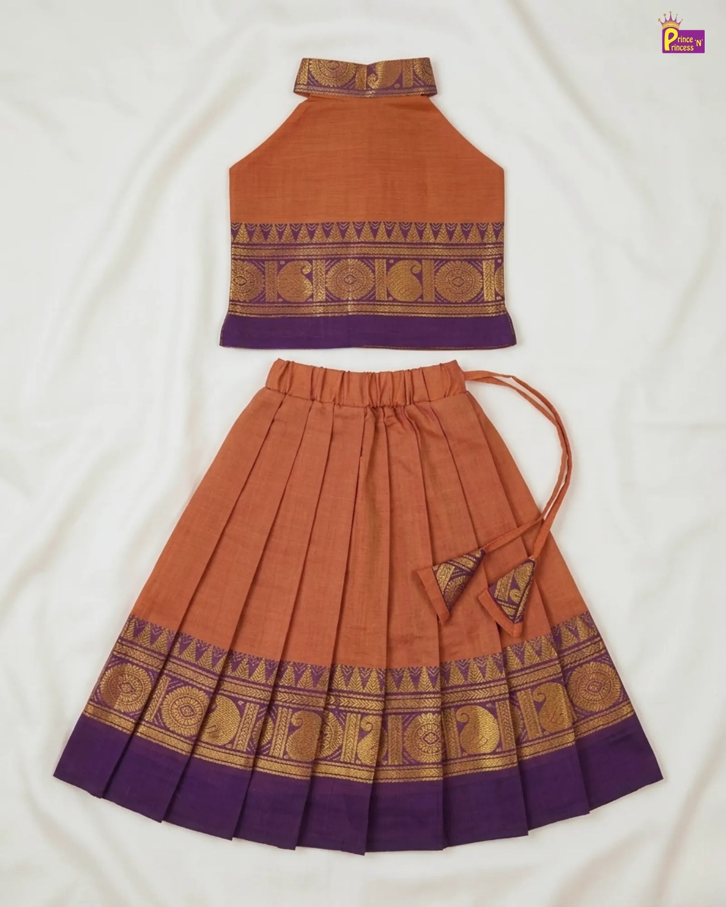 Traditional outfit with orange top and skirt on a white background
