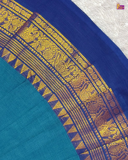 Close-up of a blue fabric with yellow and purple intricate patterns