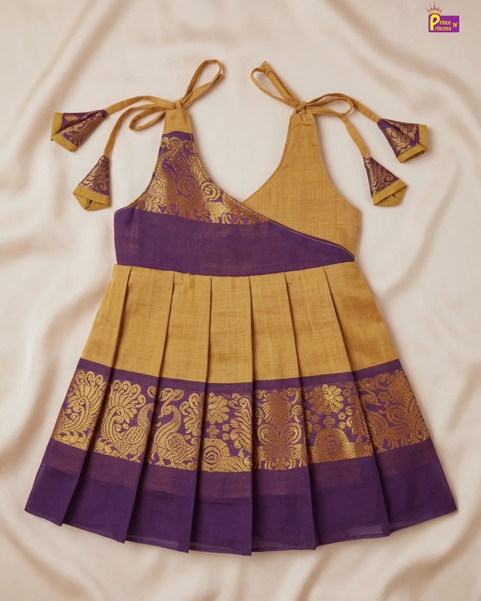 Yellow and purple traditional dress with intricate patterns on a beige background