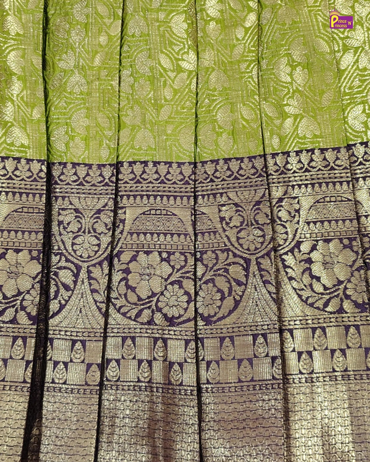Green and black patterned fabric with intricate designs