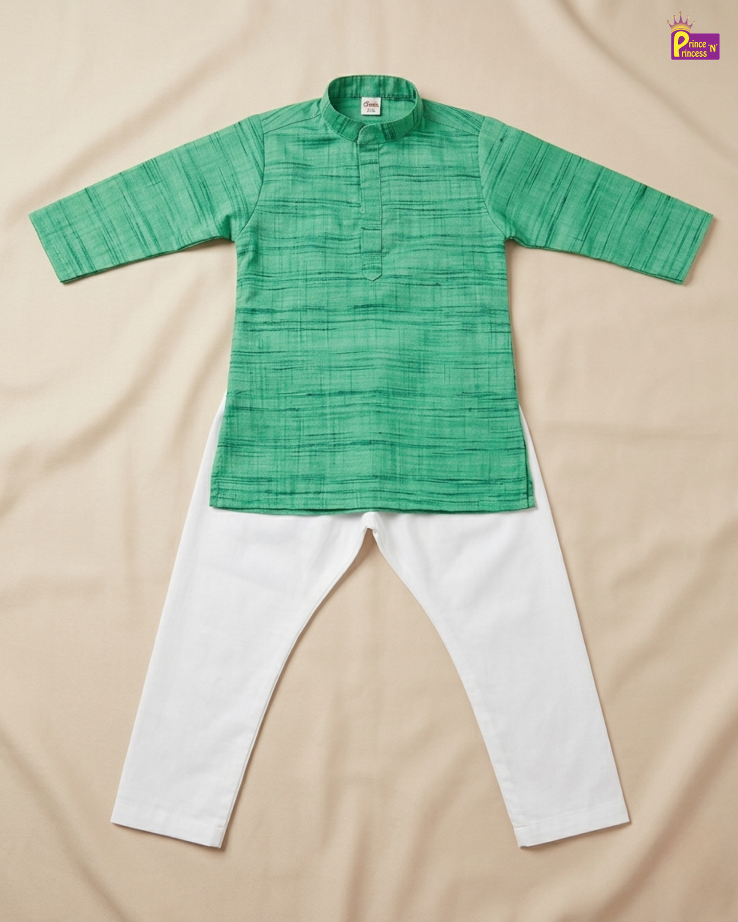 A two-piece children's outfit laid flat on a beige fabric background, featuring a green textured long-sleeve kurta with a mandarin collar and white pants.