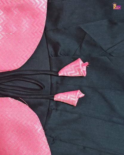 Black garment with pink floral patterns on a pink background
