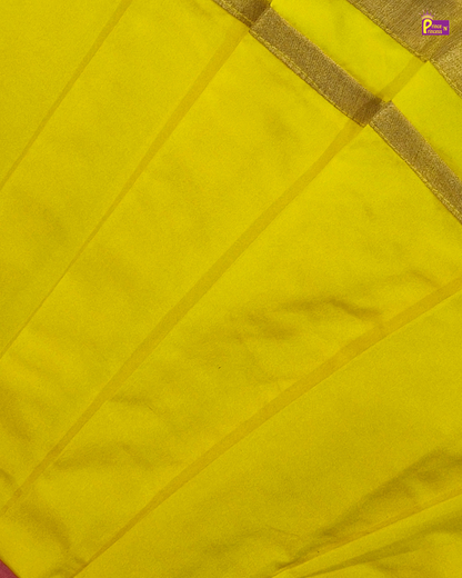Close-up of a yellow fabric with a gold border