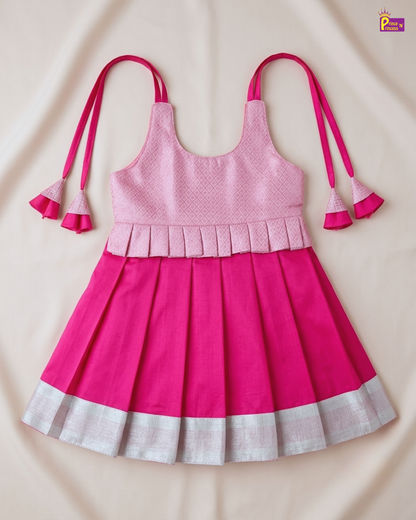 Pink dress with white trim on a beige background