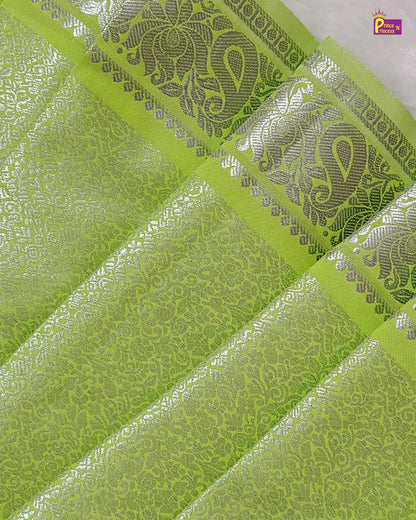Green fabric with silver embroidery patterns