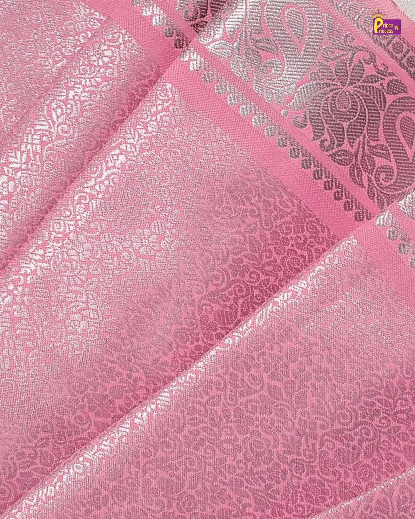 Pink fabric with silver floral patterns