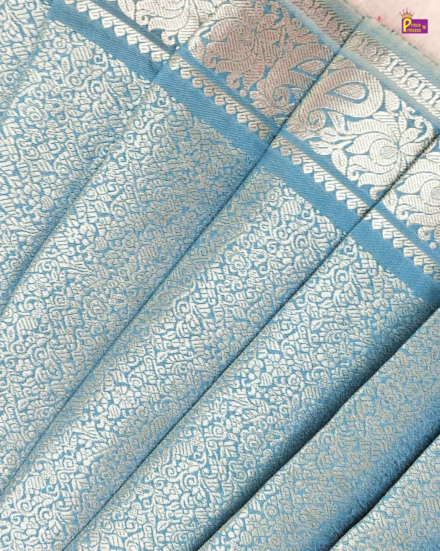 Blue and white patterned fabric with intricate designs