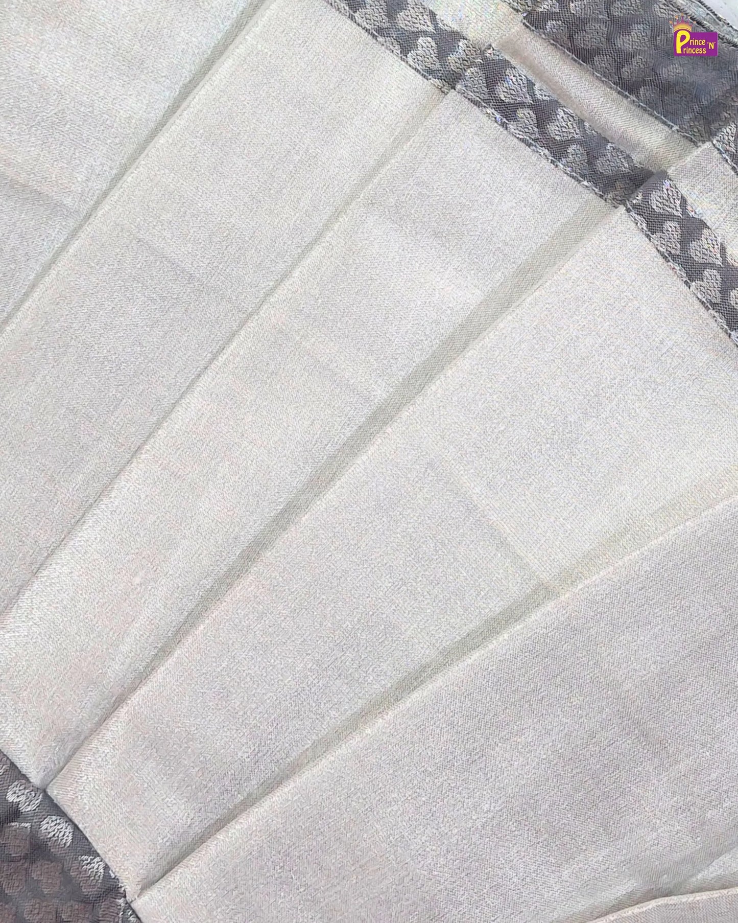Close-up of a quilt with a geometric pattern on a white background