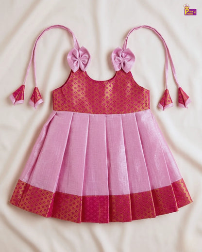 Pink and red dress with floral straps on a beige background