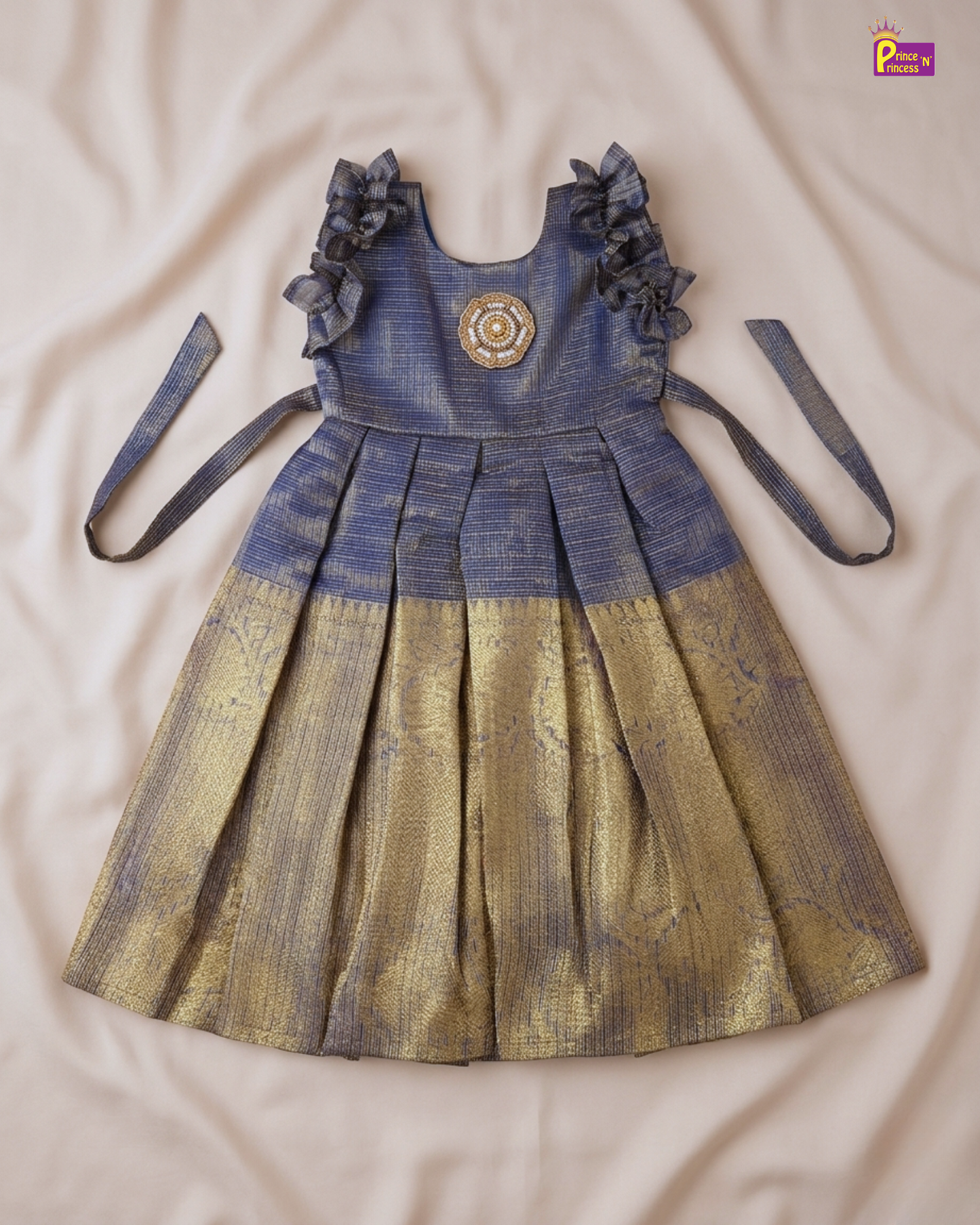 Children's dress with floral details on a beige surface