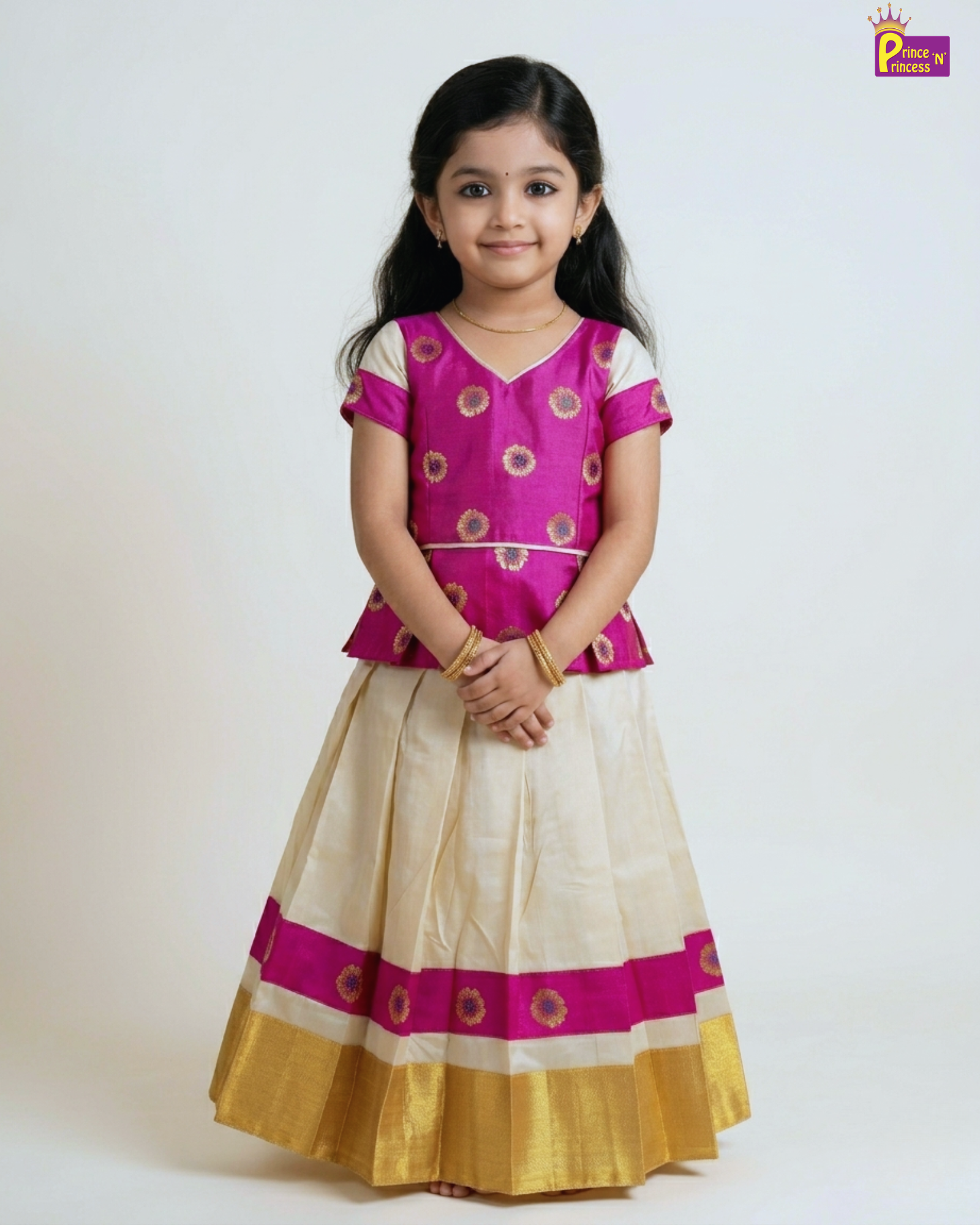 Young girl wearing a pink and gold traditional outfit on a white background
