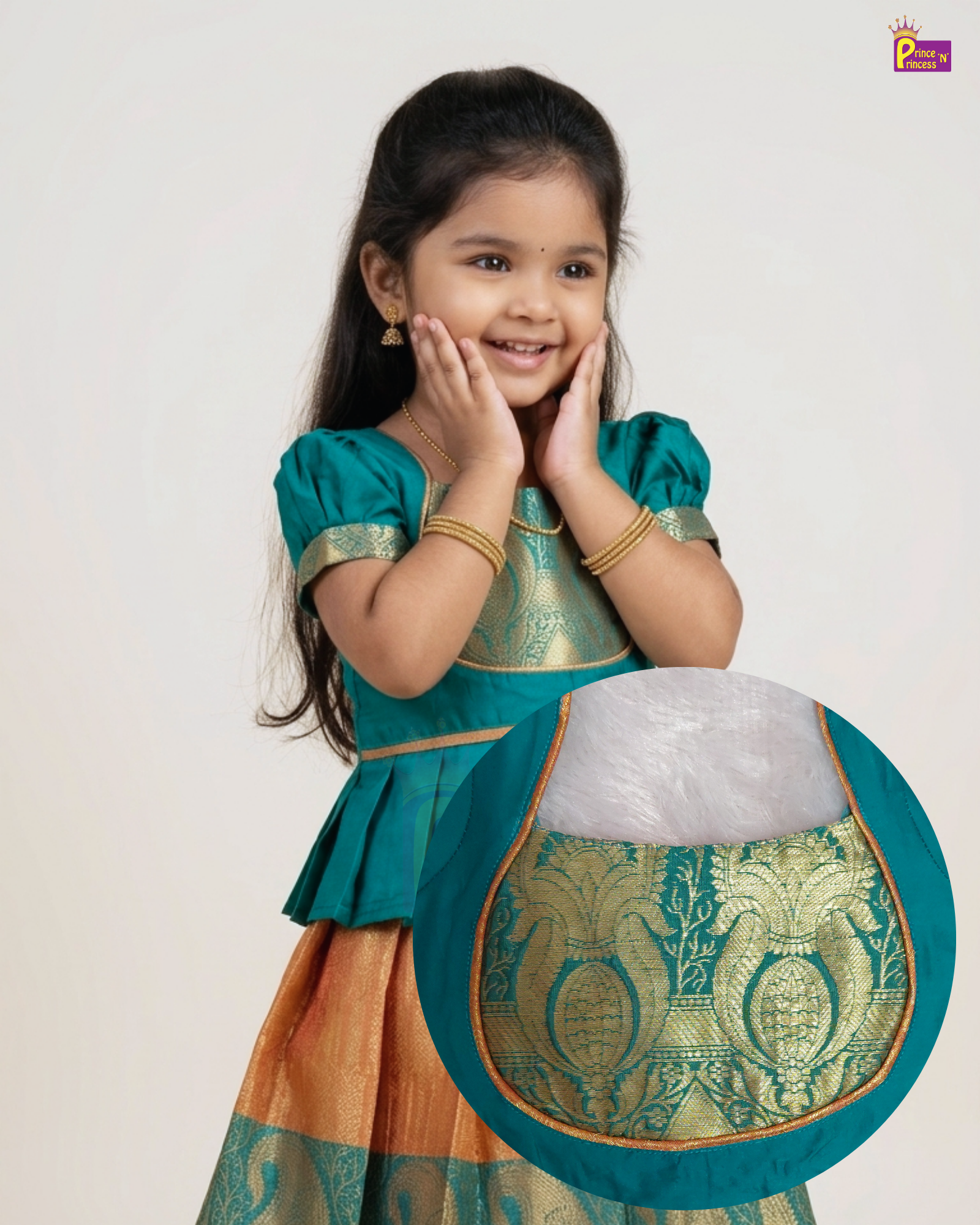A young girl modeling a traditional Indian outfit, featuring a teal green top with gold zari embroidery and a peach-orange skirt with green borders. A circular inset detail highlights the intricate gold and green patterned fabric of the skirt.