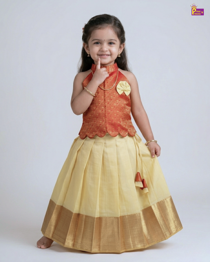 Young girl wearing a traditional outfit with a red top and yellow skirt on a white background