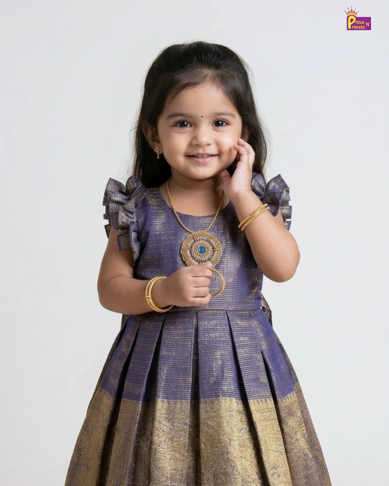 Young girl wearing a traditional outfit with a plain background