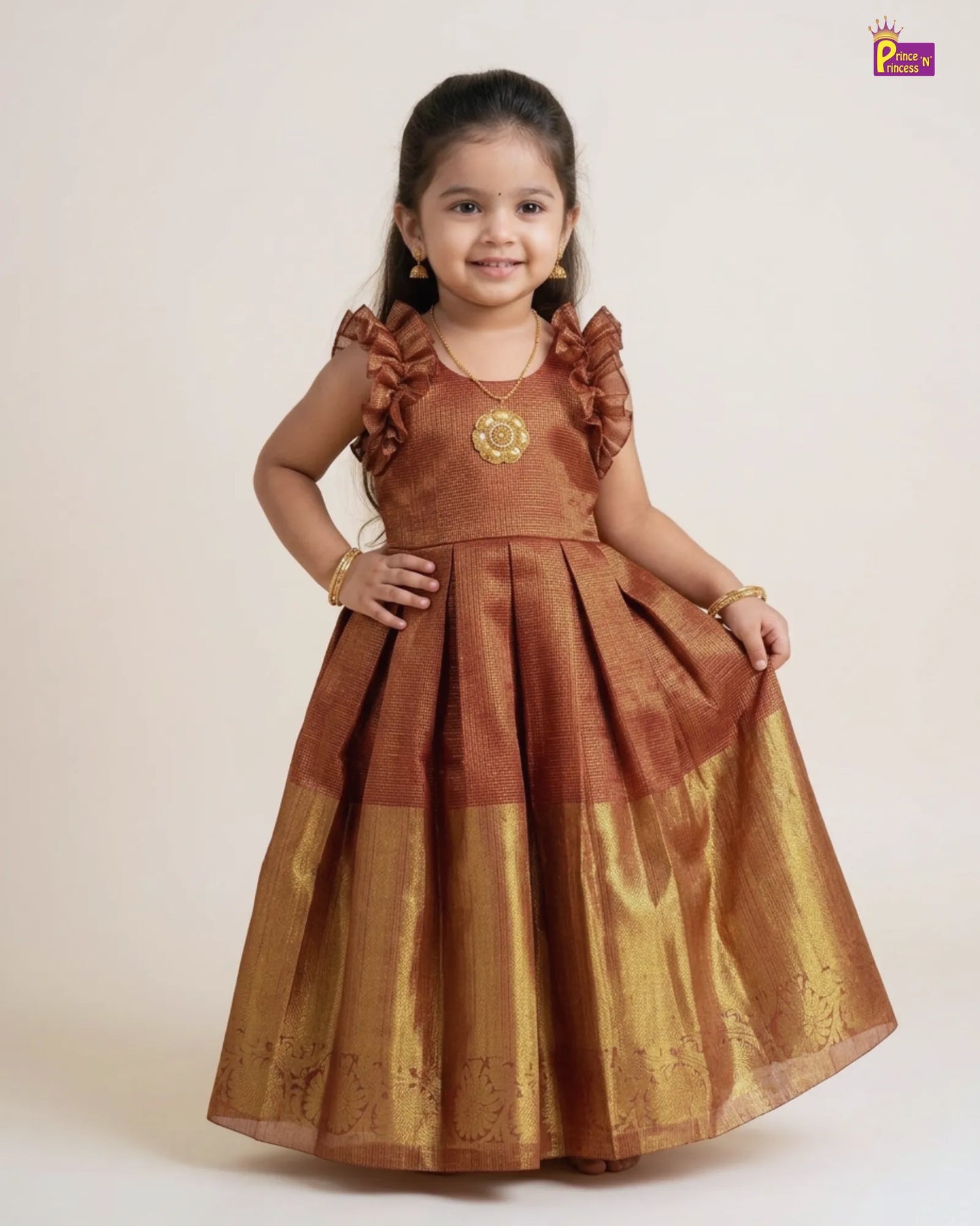 Young girl wearing a brown traditional dress with ruffled sleeves on a white background