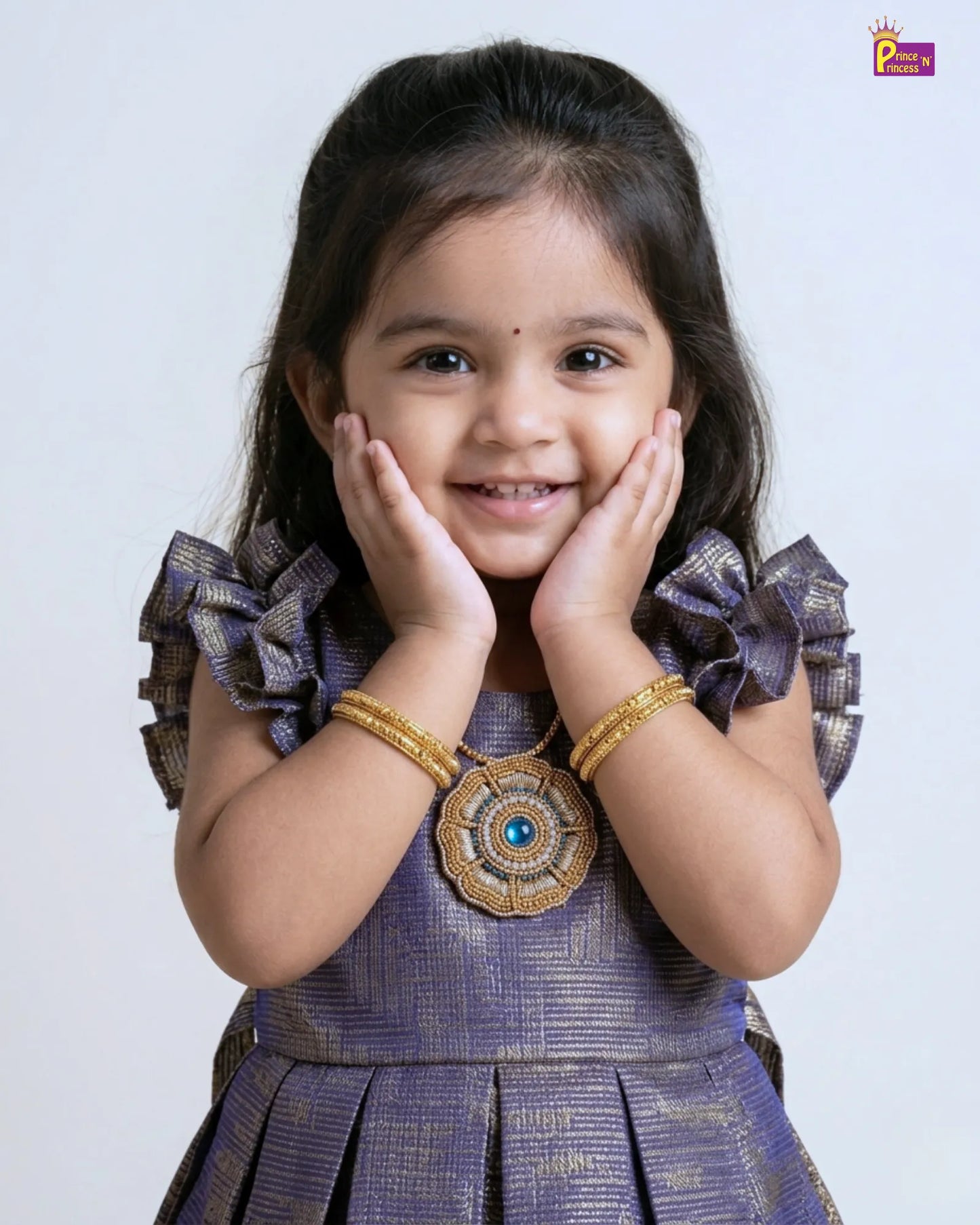 Young girl in a traditional outfit with decorative elements on a plain background