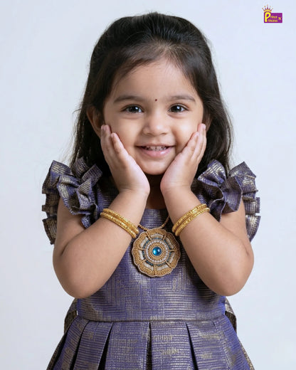 Young girl in a traditional outfit with decorative elements on a plain background