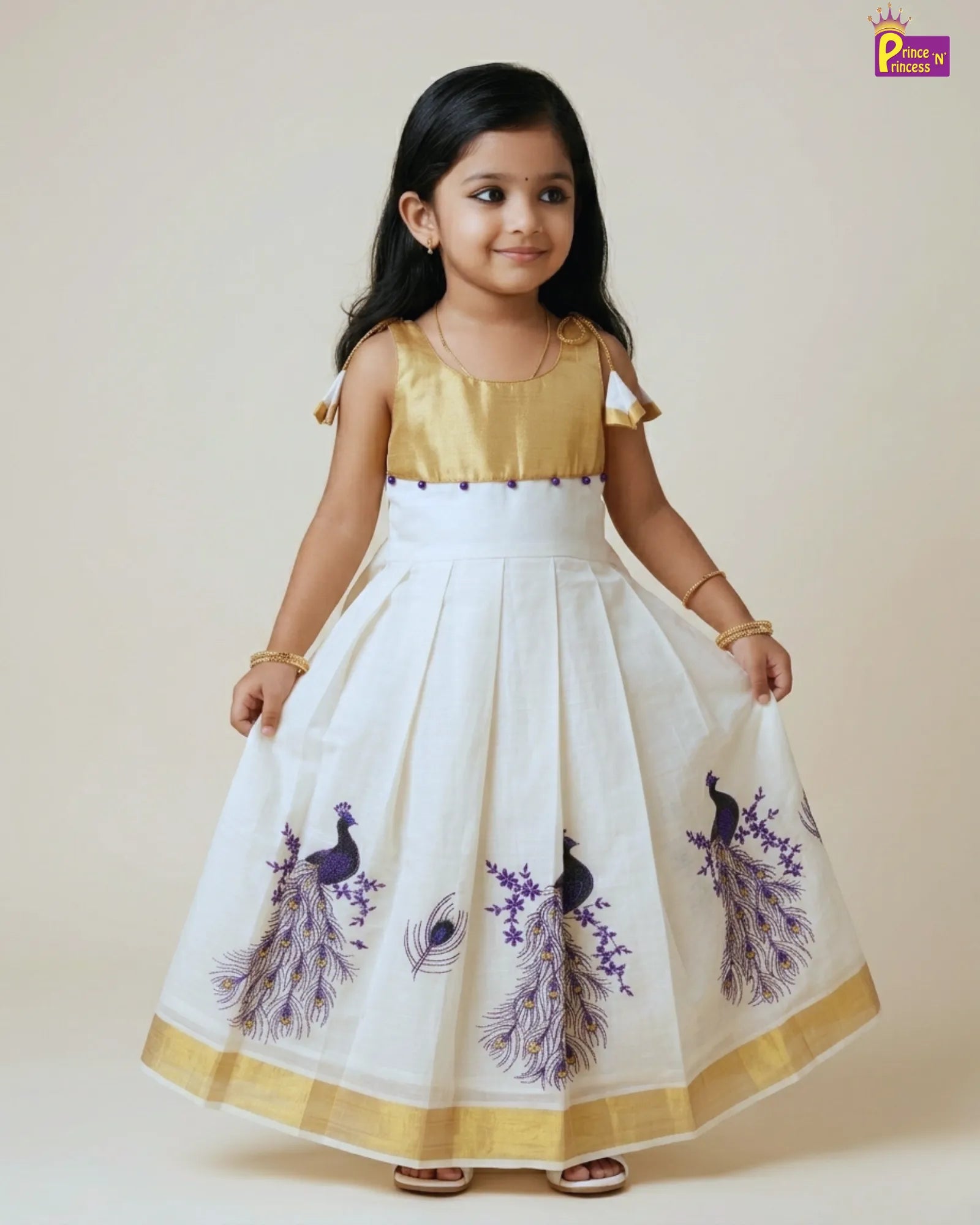 Young girl wearing a white dress with purple peacock designs on a beige background