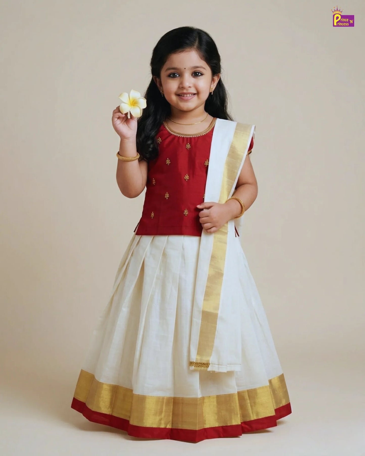 Young girl in a red and white traditional outfit holding a flower against a beige background