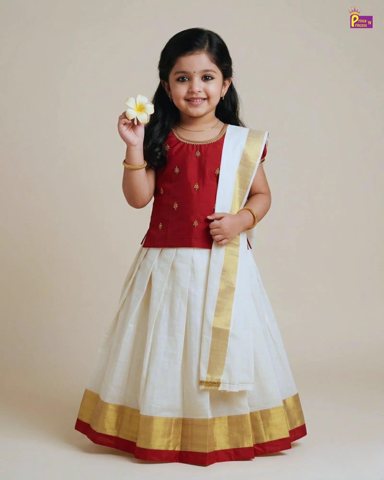 Young girl in a red and white traditional outfit holding a flower against a beige background