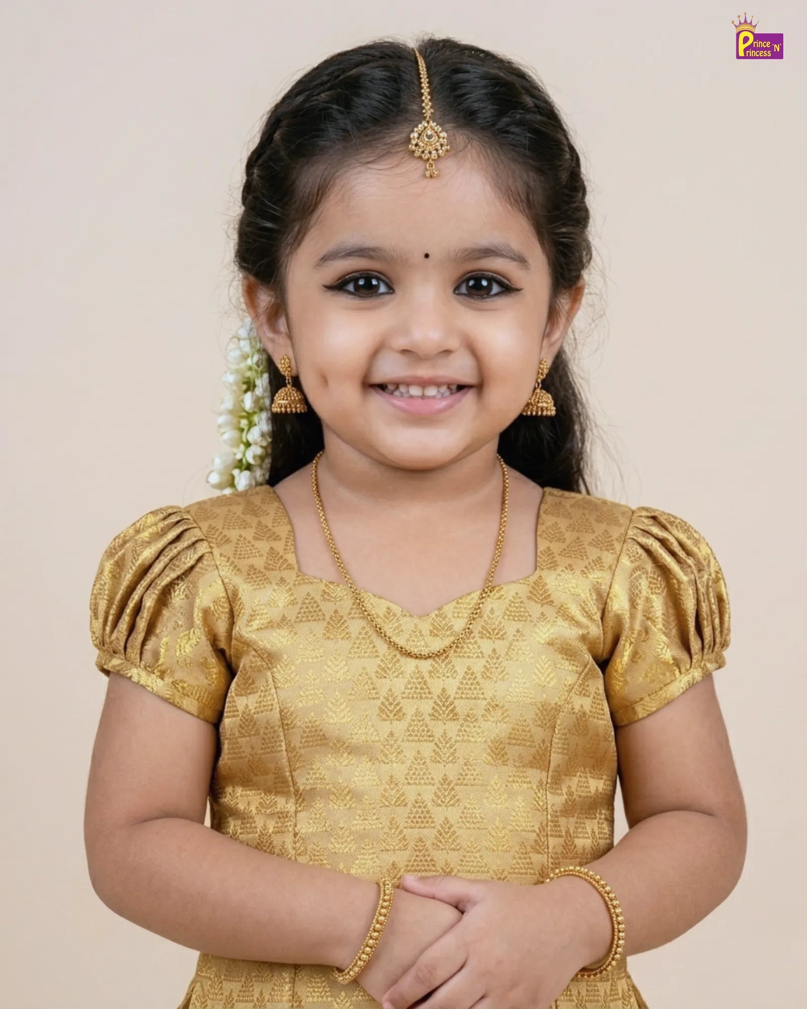 Young girl in a gold traditional outfit with a plain background