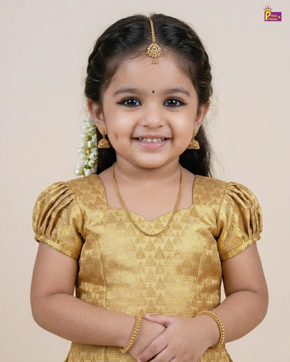 Young girl in a gold traditional outfit with a plain background